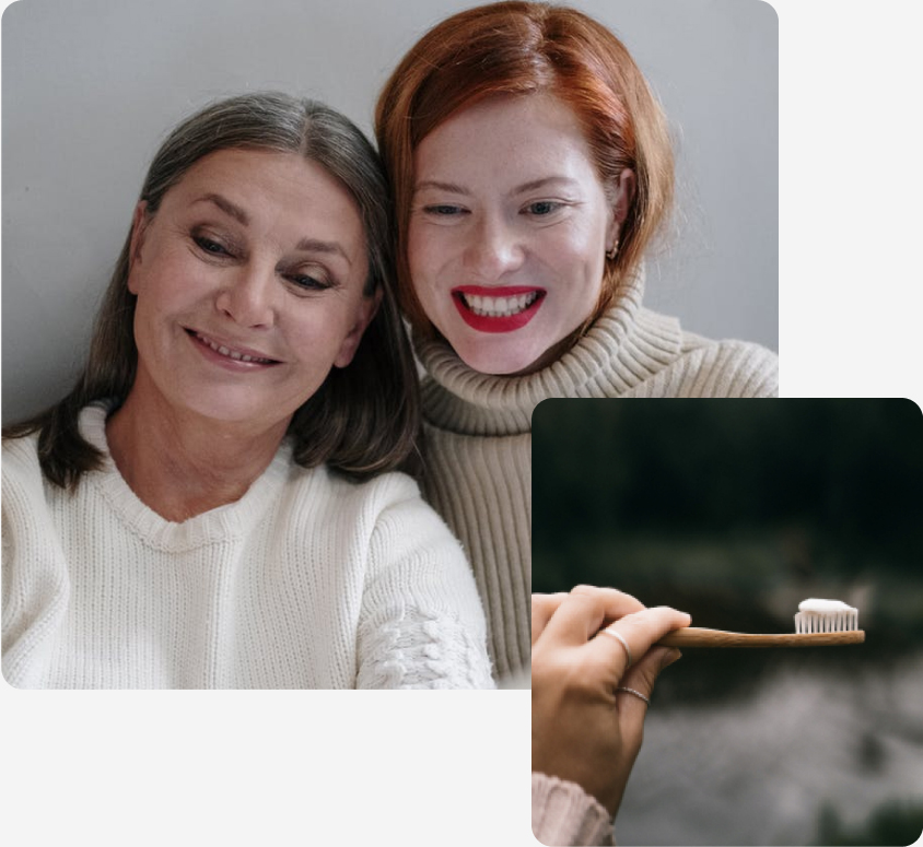 two lady are smiling and a girl holding tooth brush